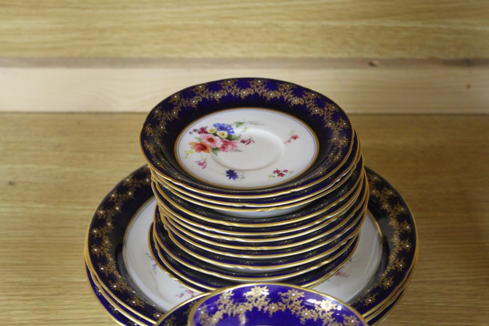 A Royal Worcester part tea service, painted with flower sprays by Ernest Phillips and Ernest Barker,